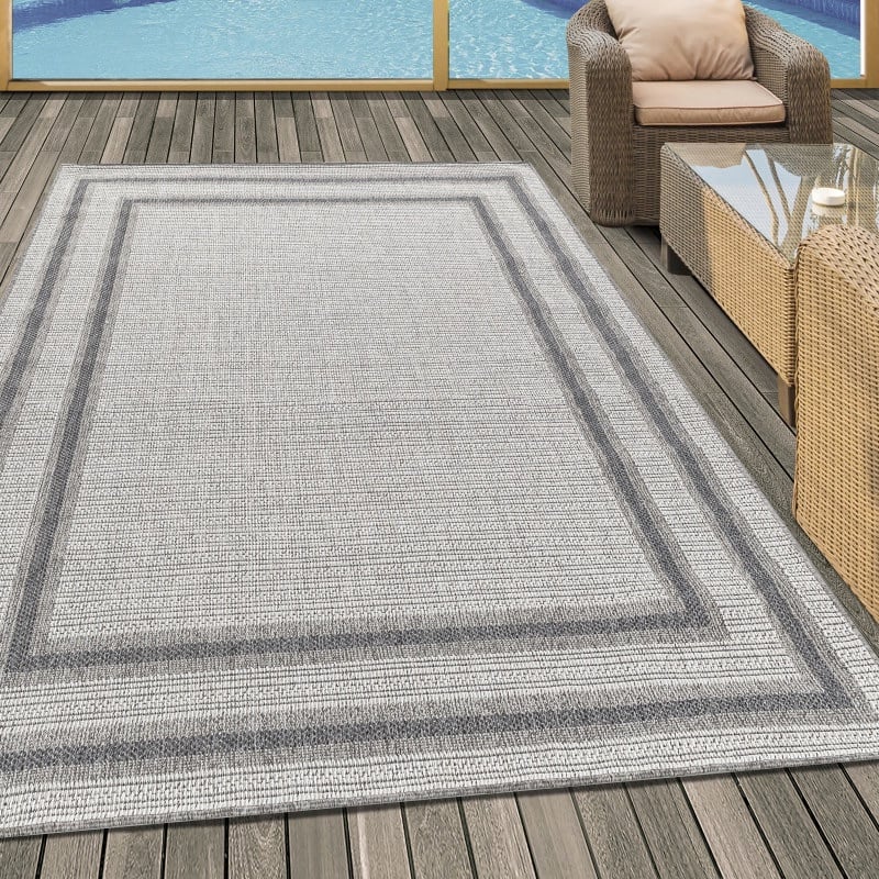 Hazel Indendørs/Udendørs Gulvtæppe i Creme med Simpel Grå Kant fra Rugs by Uniquebeds Home & Living | Flere Størrelser