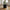 Gamby puf i sort velour med messing kant fra House Nordic | ø34x43 cm