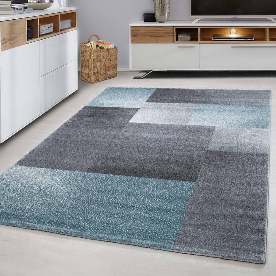 Elijah Gulvtæppe i Blå med Kant fra Rugs by Uniquebeds Home &amp; Living | Flere Størrelser