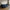 Lido Venstrevendt Loungesofa i Mørkeblå Velour med Fire Puder & Ben i Natur Bøgetræ fra House Nordic | B290xL170-92xH76 cm