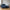 Lido Venstrevendt Loungesofa i Mørkeblå Velour med Fire Puder & Ben i Natur Bøgetræ fra House Nordic | B290xL170-92xH76 cm