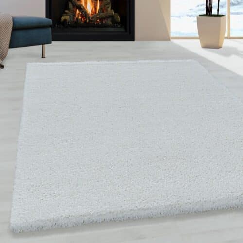 Louisa Ensfarvet Gulvtæppe i Hvid fra Rugs by Uniquebeds Home & Living | Flere Størrelser i Firkantet & Rund