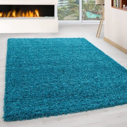 Luna Ensfarvet Fluffy Gulvtæppe i Turkis fra Rugs by Uniquebeds Home & Living | Flere Størrelser i Firkantet & Rund