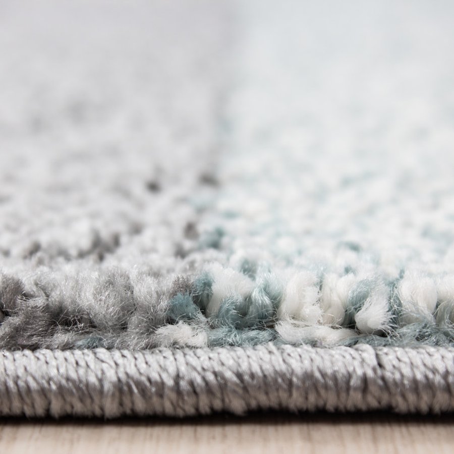 elijah-gulvtaeppe-i-blaa-med-kant-fra-rugs-by-uniquebeds-hom-LUCCA801501810BLUE-2 Elijah Gulvtæppe