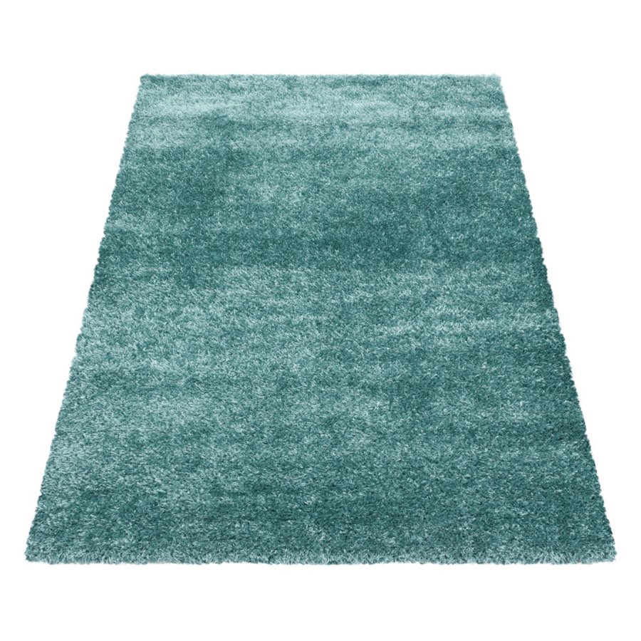 lukas-gulvtaeppe-i-turkis-med-kant-fra-rugs-by-uniquebeds-ho-BRILLIANT1201204200AQUA-5 Lukas Gulvtæppe