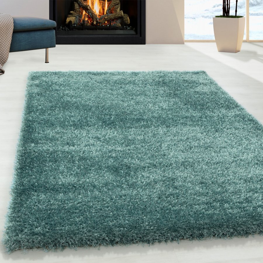 lukas-gulvtaeppe-i-turkis-med-kant-fra-rugs-by-uniquebeds-ho-BRILLIANT601104200AQUA-1 Lukas Gulvtæppe