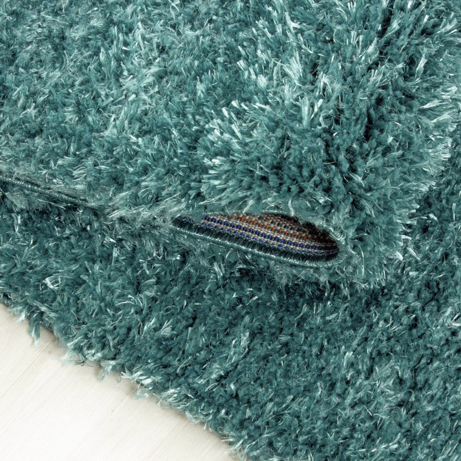 lukas-gulvtaeppe-i-turkis-med-kant-fra-rugs-by-uniquebeds-ho-BRILLIANT802504200AQUA-3 Lukas Gulvtæppe