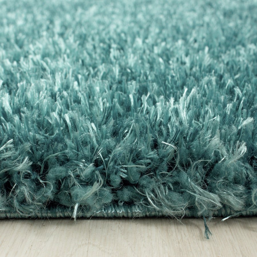 lukas-gulvtaeppe-i-turkis-med-kant-fra-rugs-by-uniquebeds-ho-BRILLIANT80804200AQUA-2 Lukas Gulvtæppe